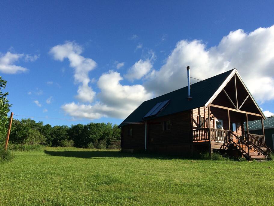 Year-round cabin sits on hilltop with great views.