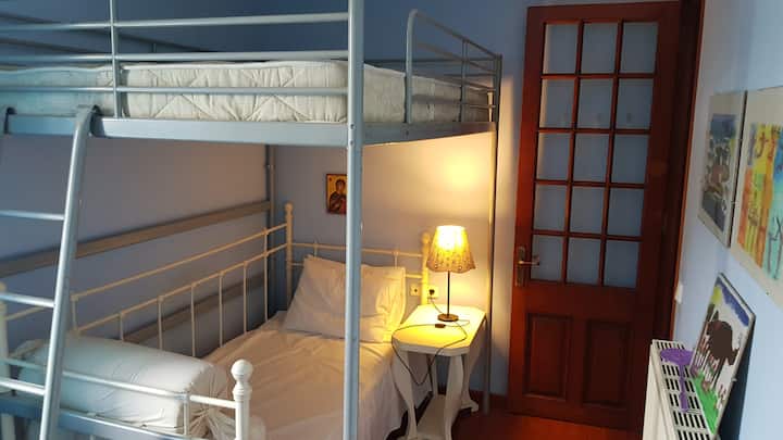 Bedroom with double bunk bed and single bed on the first floor.