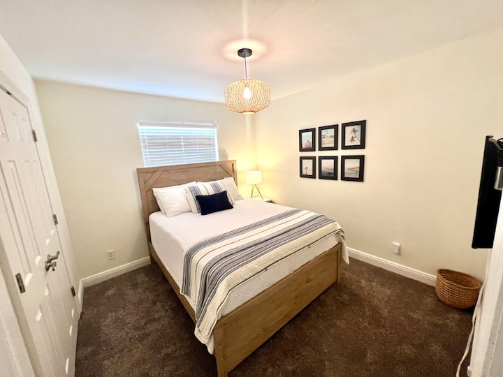 Queen bedroom with smart TV. 