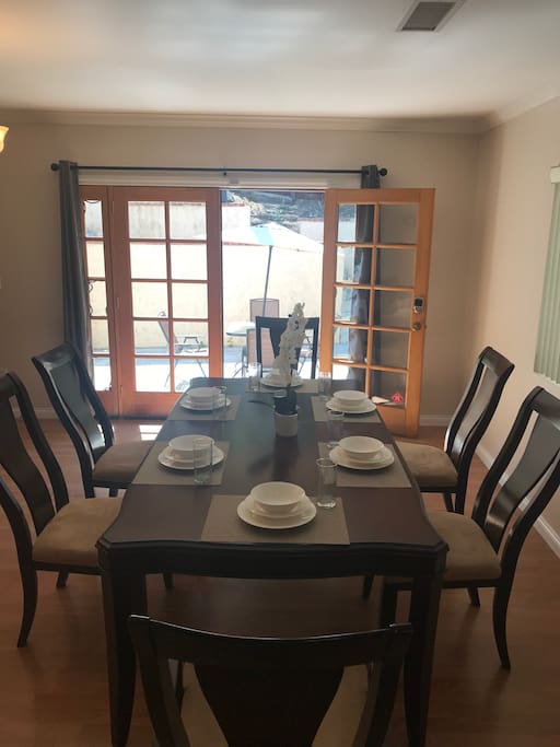 Large dining table sits for 6 and it can be extended to sit 8