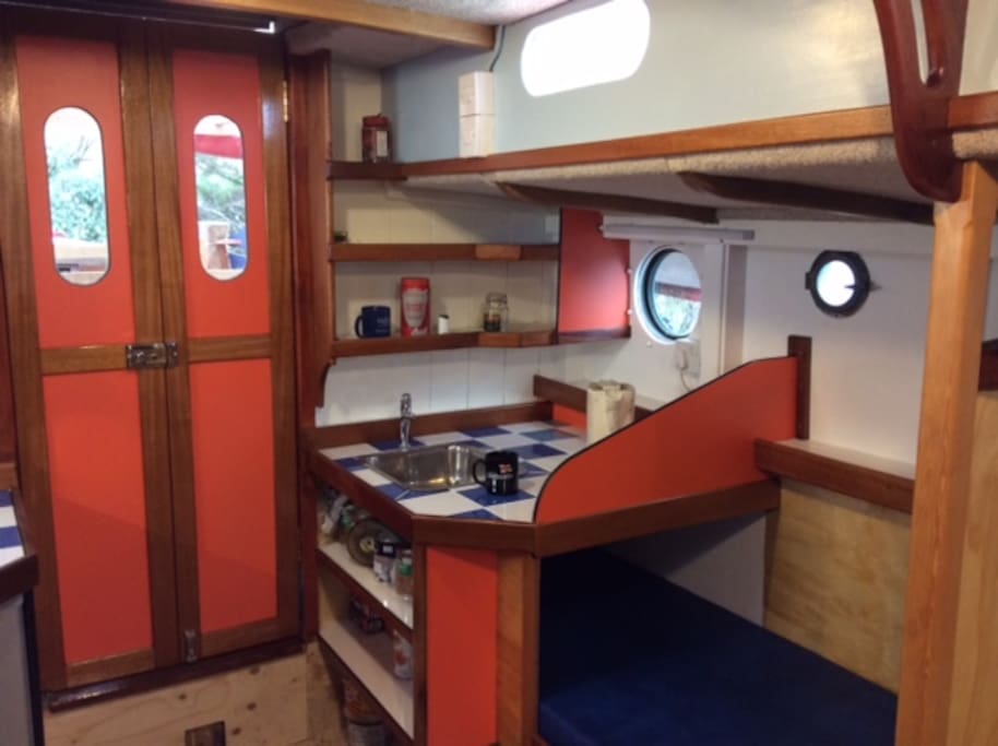 Port Galley with running water and kettle, fully equipped with crockery.