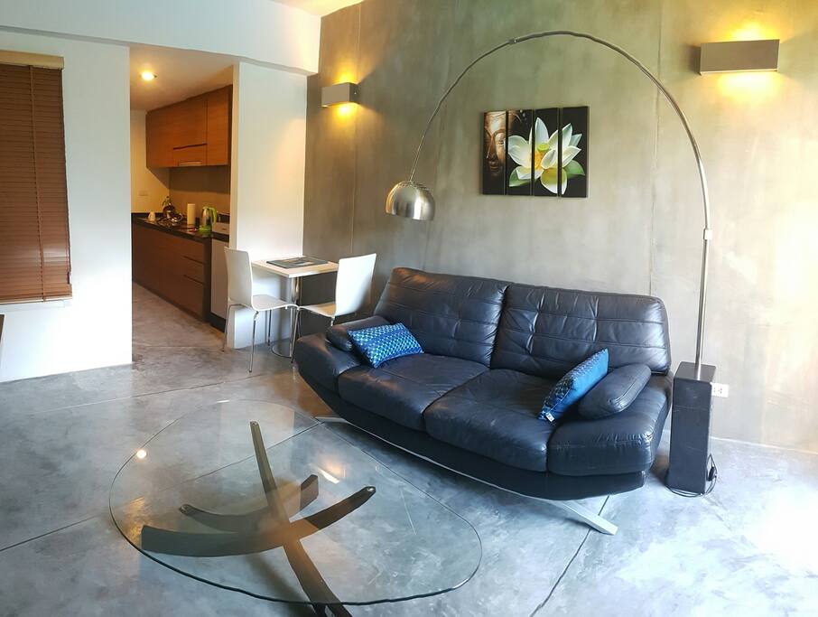 Comfortable couch and small dining table in livingroom. Equipped with its own A/C unit.
