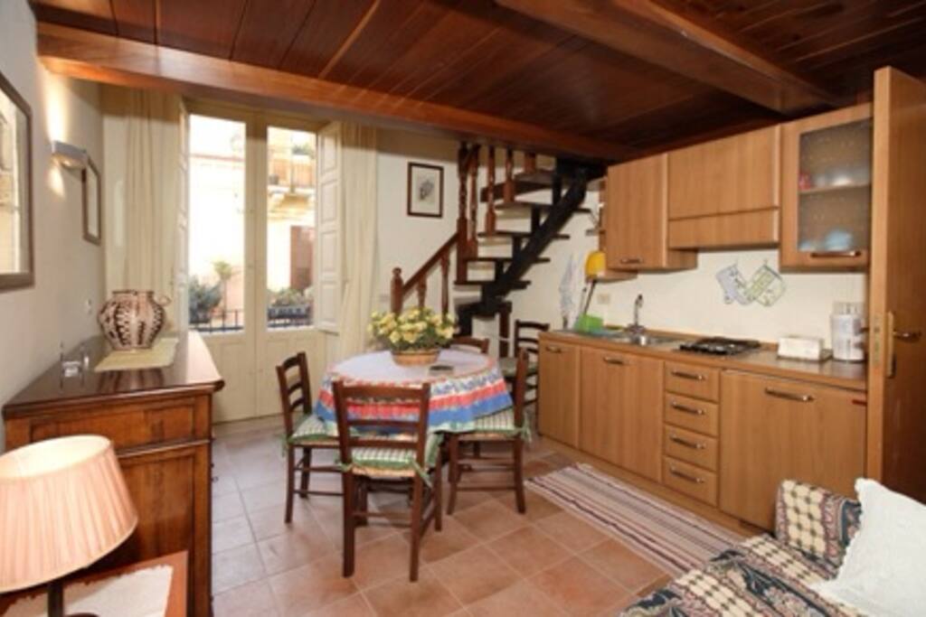 Living room with kitchenette and double sofa bed