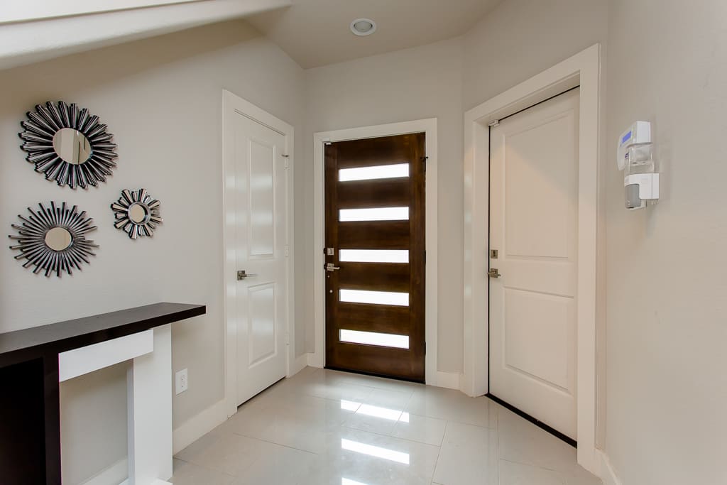 Foyer front entrance with garage door and closet on 1st floor