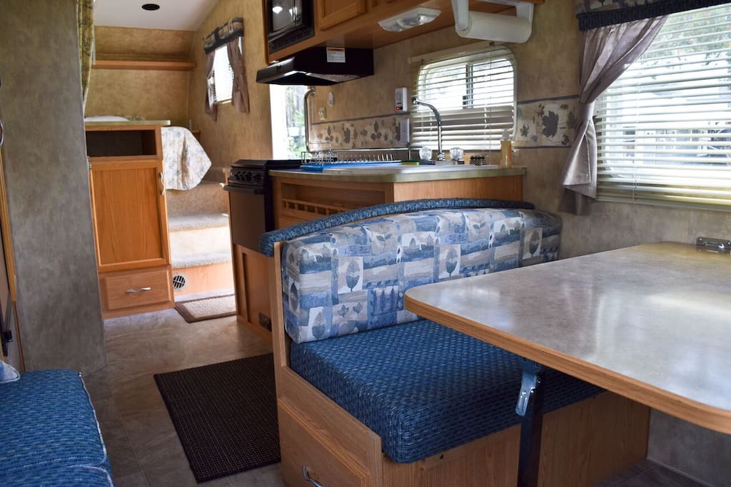 Queen bed up front. Sofa bed and small dinette bed.