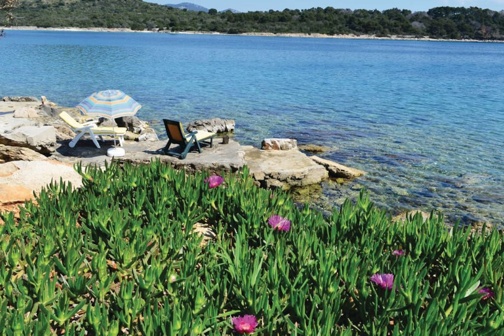 Private beach in front of the house