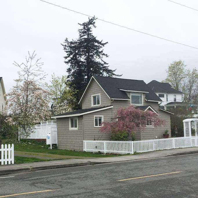 Side view of the property. The driveway provides off-street parking for up to four cars.