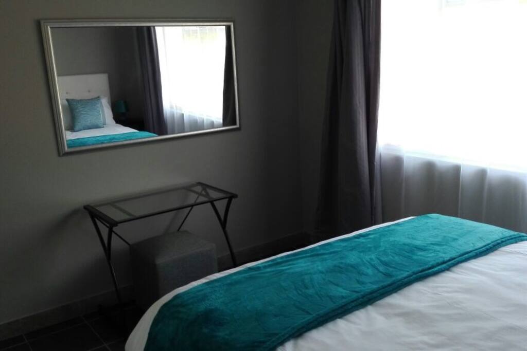 Each room contains a dressing table or desk, pedestal and large mirror.