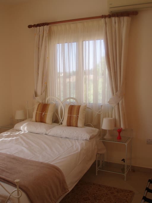 Double bed, en-suite shower room with WC, and large sunny balcony overlooking stunning rolling hills and valleys