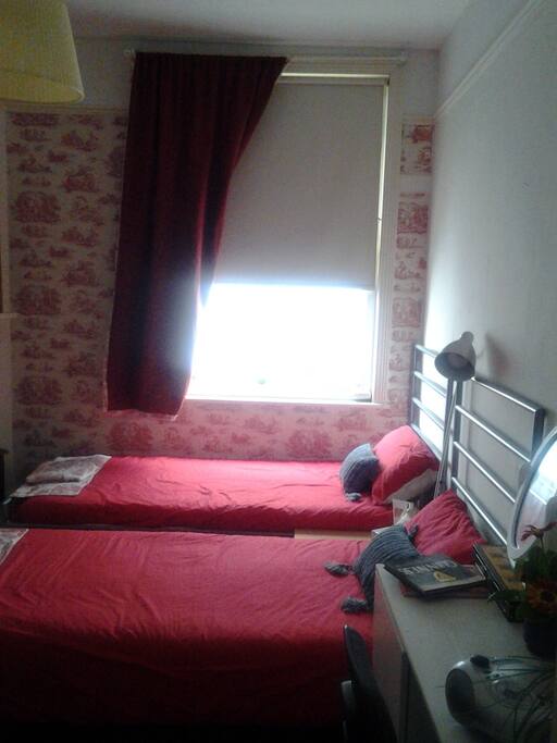 Double (Red room) includes twin beds, built in wardrobes/cupboard containing mini fridge for guest(s) personal use. Tea/coffee making facilities, small coffee table, desk (with storage) and chair Radio/CD player, Welcome and information basket.