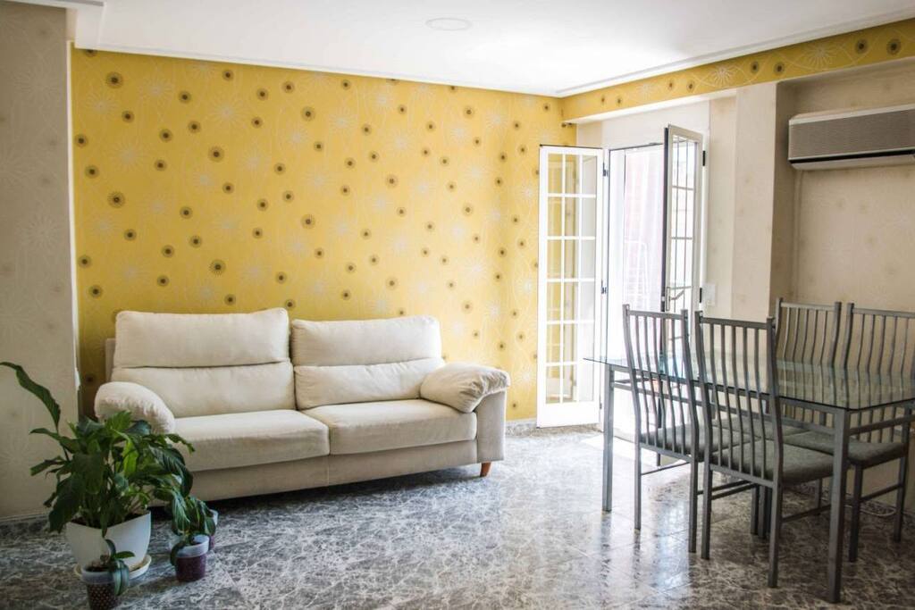 Bright living room with balcony and AC