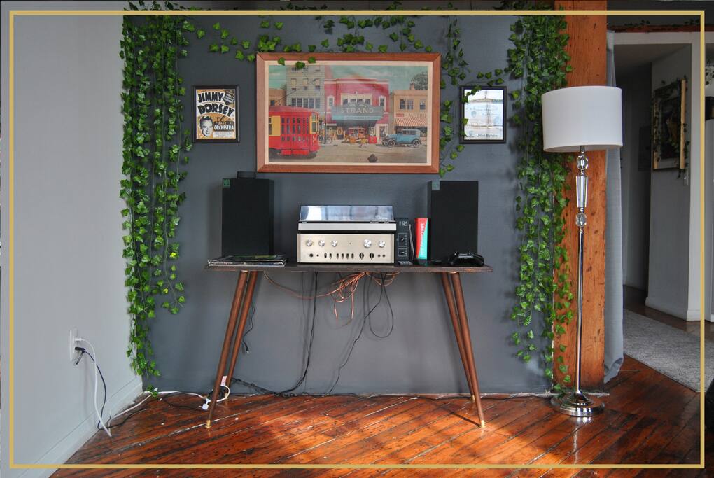 Record player with select vinyls for each reservation. *The wires have since been hidden!