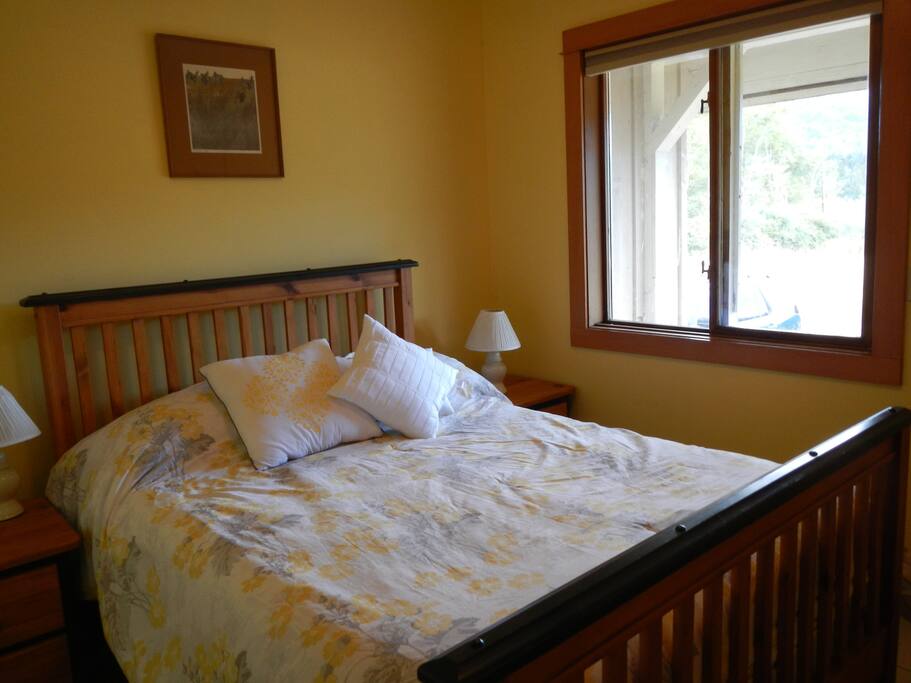 bed with farm view out window