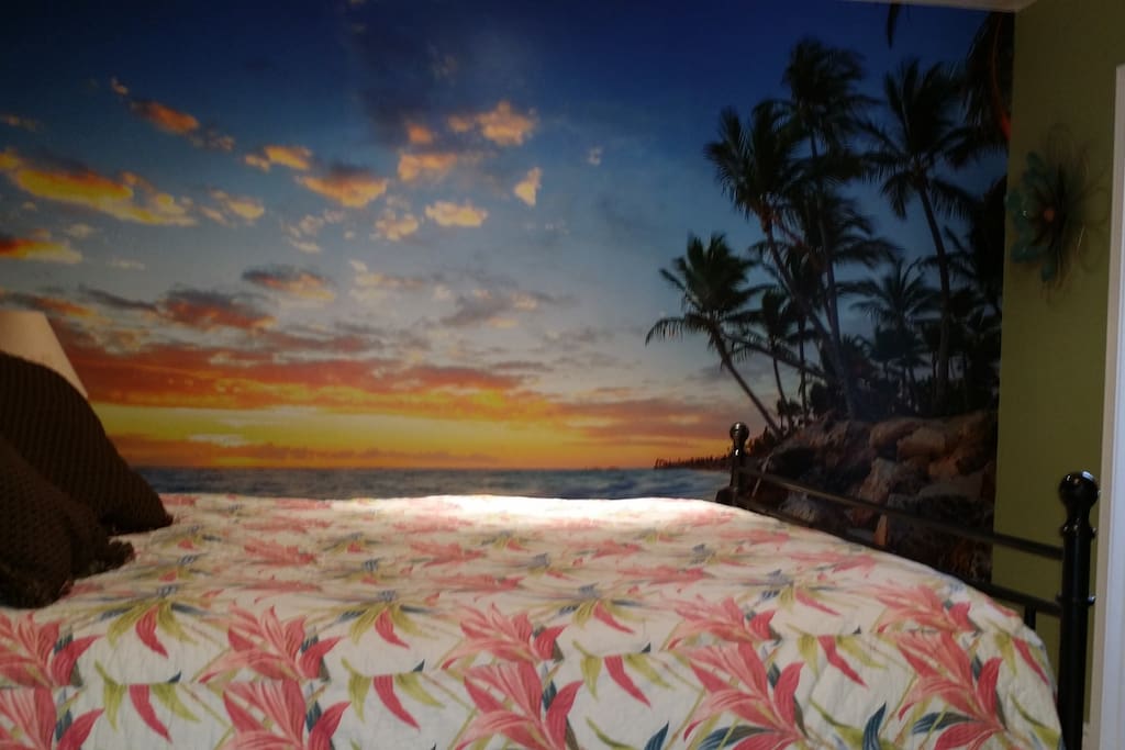 Queen size Bed with a beach mural to fall asleep too