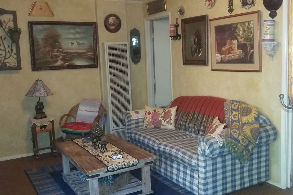 Our fully decorated living room makes into a comfortable full size bed with a 32" flat screen for viewing.. HBO/SHT
Large coffee table can be used for games or dining. WIFI available plus SHO/STARS