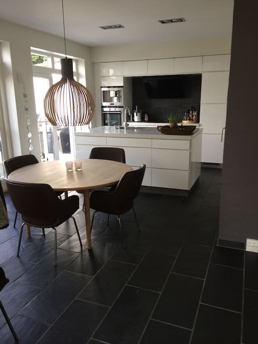 Kitchen/dining room connected to the big terrace by two double doors.