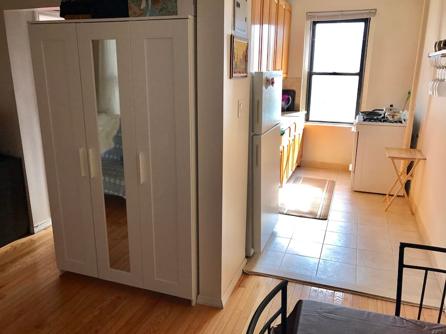 Beautiful sunny kitchen and you fan see a wardrobe thats gonna be empty for you to use.
