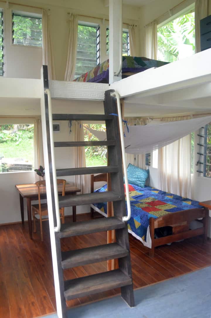 Steep ship's style stair takes you to upper room where there is double bed.