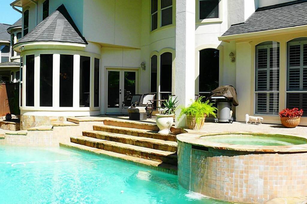 Resort style heated salt water pool and hot tub area