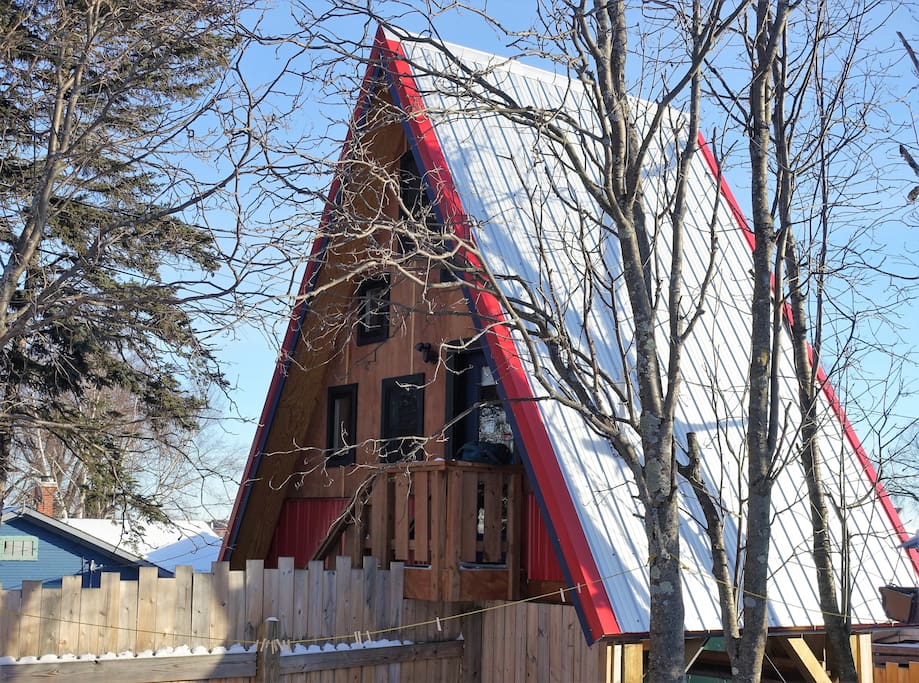 The Birdhouse, built up in the trees, gives you a bird's eye view of the Grand Marais harbor
