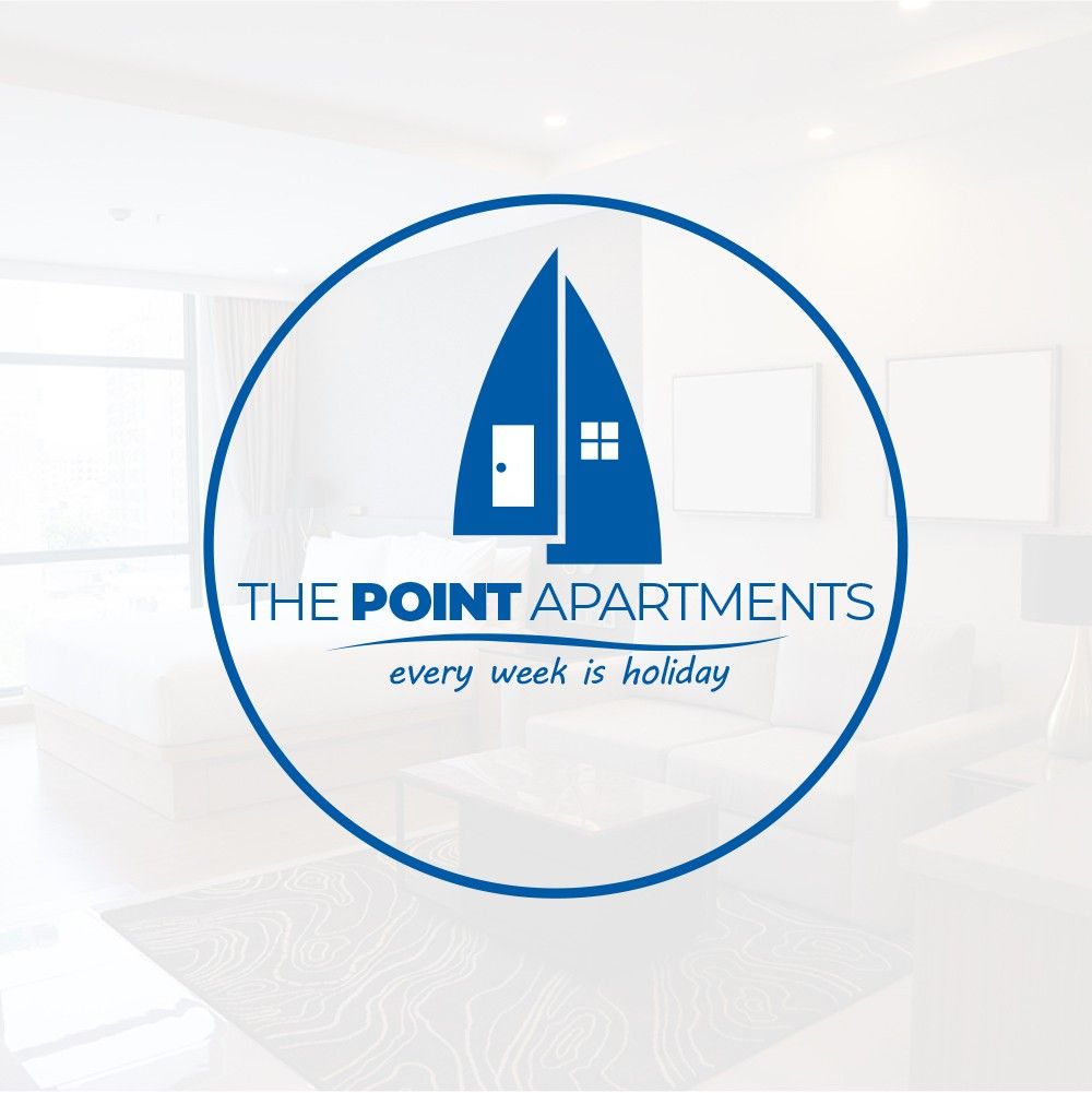 The image displays a logo for The Point Apartments, featuring a minimalist design with a sailboat and a house icon. The background room shows a bright and open space, indicating a modern apartment setting, complemented by light-colored walls and minimal furnishings.