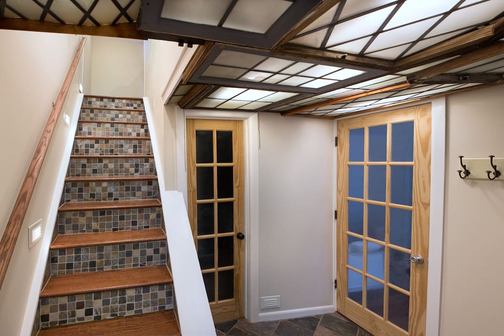 Entry way adorned with handpicked reclaimed window panes.