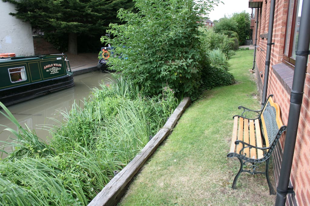 Our Garden Bench outside rear of apartment to enjoy a drink and watch the barges and wildlife passing by!