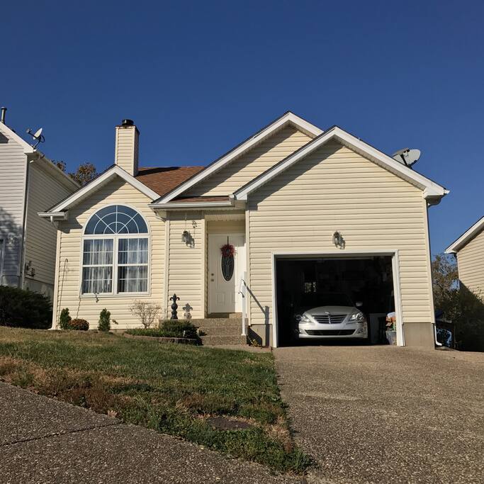 1-car garage parking with 4 additional spaces in driveway