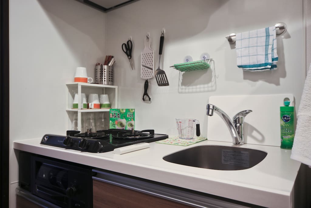 Kitchen with utensil, cutlery, glasses and mags. Pot, pan and dishes are also available!