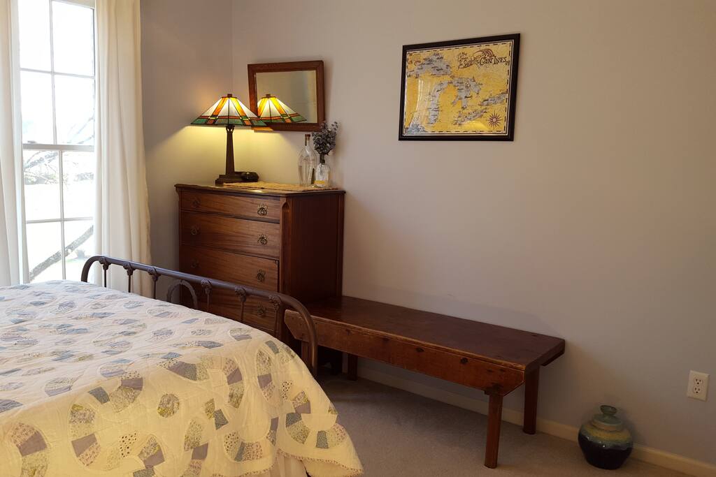 Antique chest of drawers for clothes; large bench for luggage.