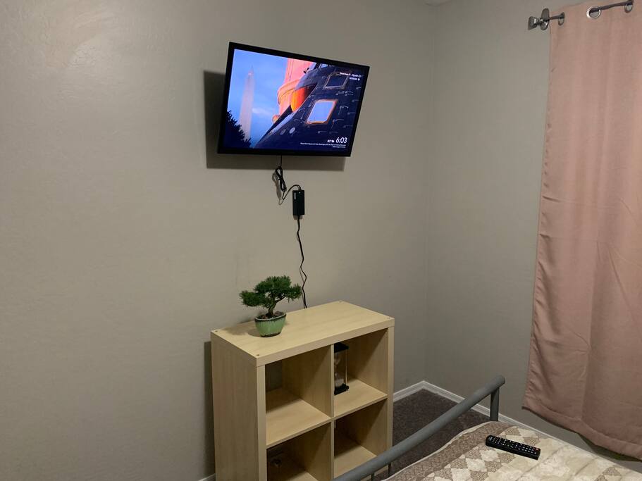 32” wall mounted tv with chromecast is also set up in the room