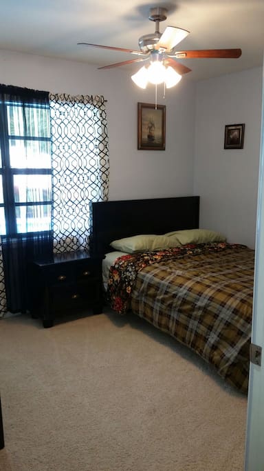 Very nice bedroom #1 with tv, queen size bed, and full view of pool n backyard
