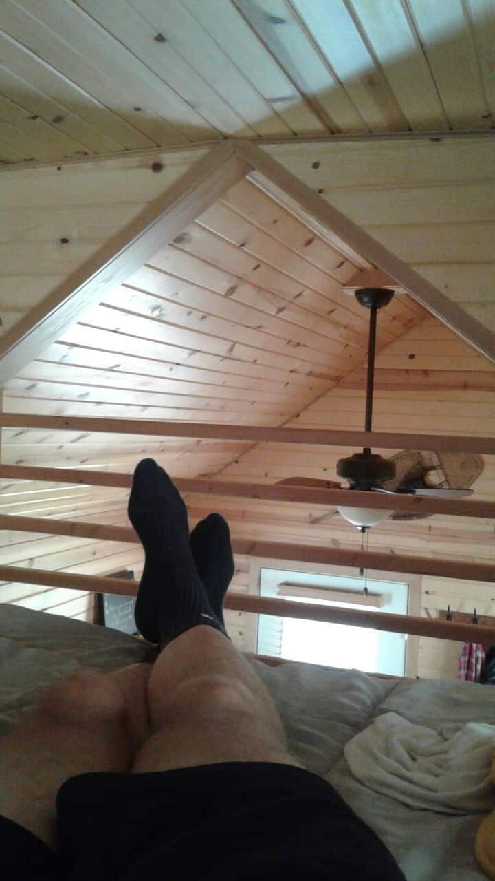 Relaxing on the queen memory foam bed in the loft. Most say the cabin is bigger than they expected.