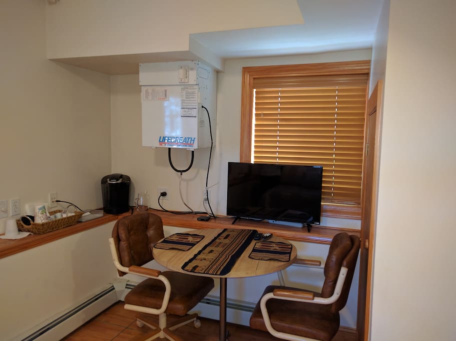 Seating area with coffee maker and TV