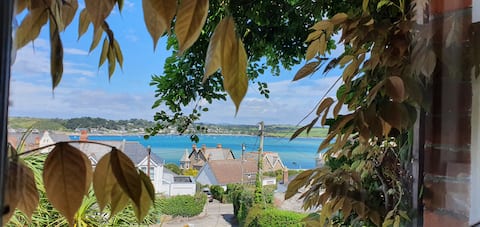 The Retreat - front & back gardens with patios