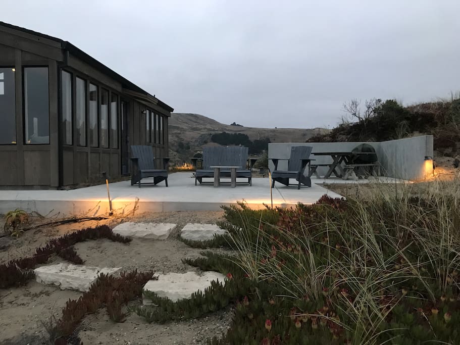 Patio at dusk with path to beach