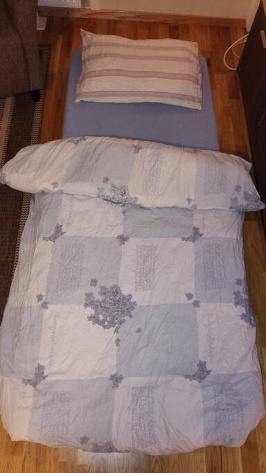 Cozy floor mattress on offer, with pillow and blanket