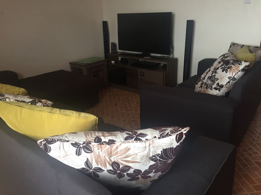 Living room. Visitors can get access to Dstv and free wifi
