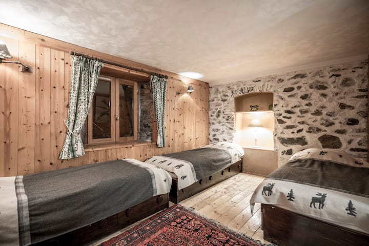 Rustic chic Tannerie firm chalet, bedroom No.1  in country wood and stone with en-suite bathtub and 3 beds