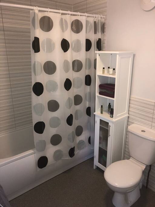Bathroom with bath and shower