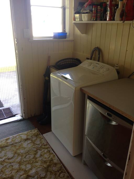 Back door in to laundry, washing machine & two dish drawers.