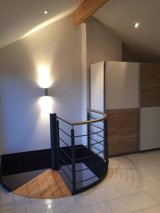 Stairs to the Living Room, Kitchen and Bathroom.