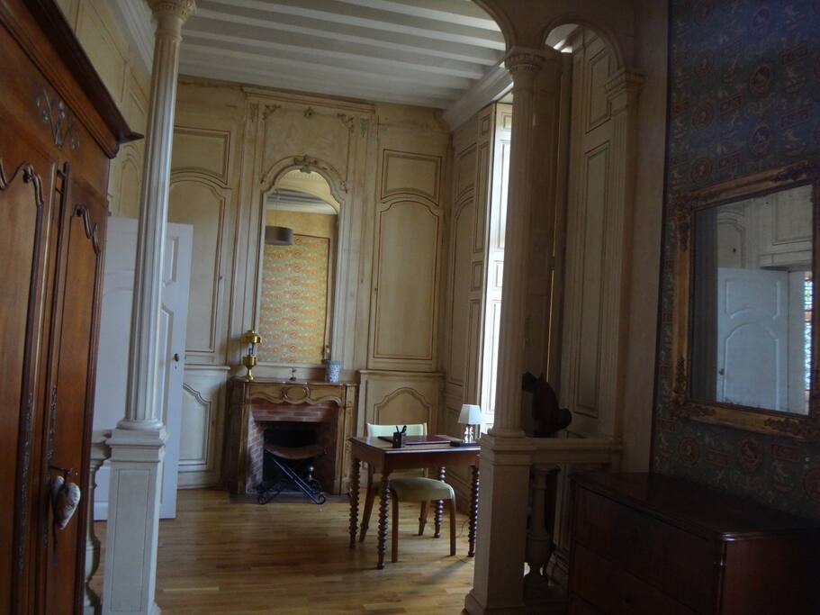 The study desk by the window in the bedroom