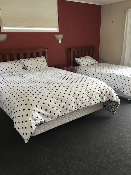 Upstairs master bedroom with extra king single bed and pop up bed.