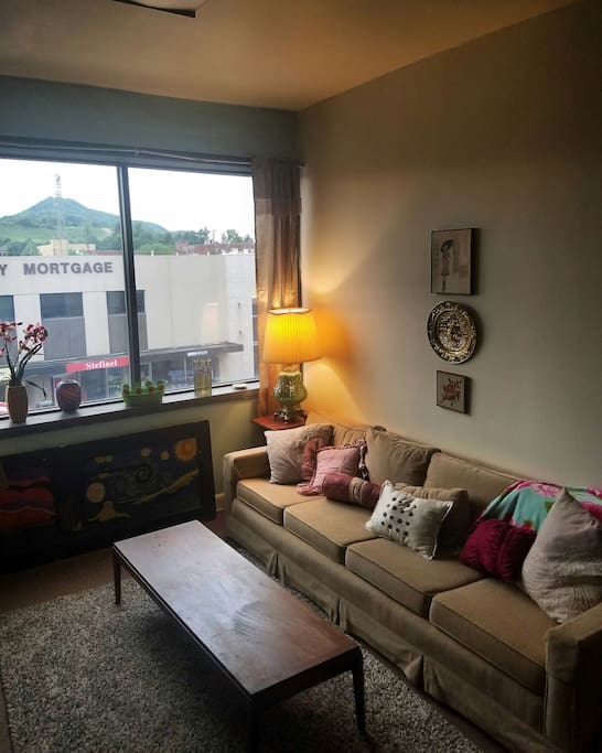 couch, 9 feet long with removable back cushions, good view of Bay's Mountian!