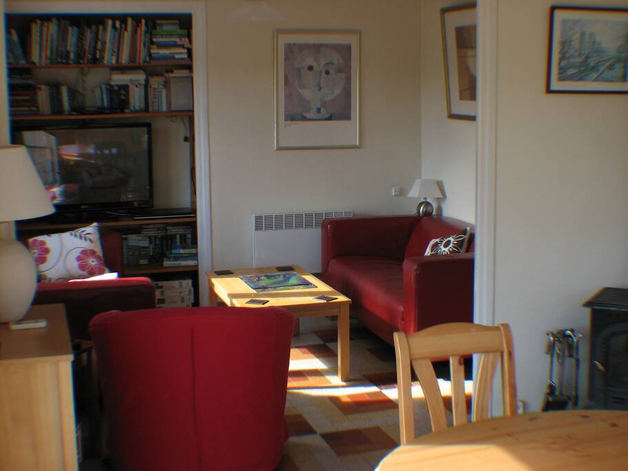 Lounge / Dining Area - Complete with UK television, air-conditioning (hot&cold), electric heater and wood burning stove.
