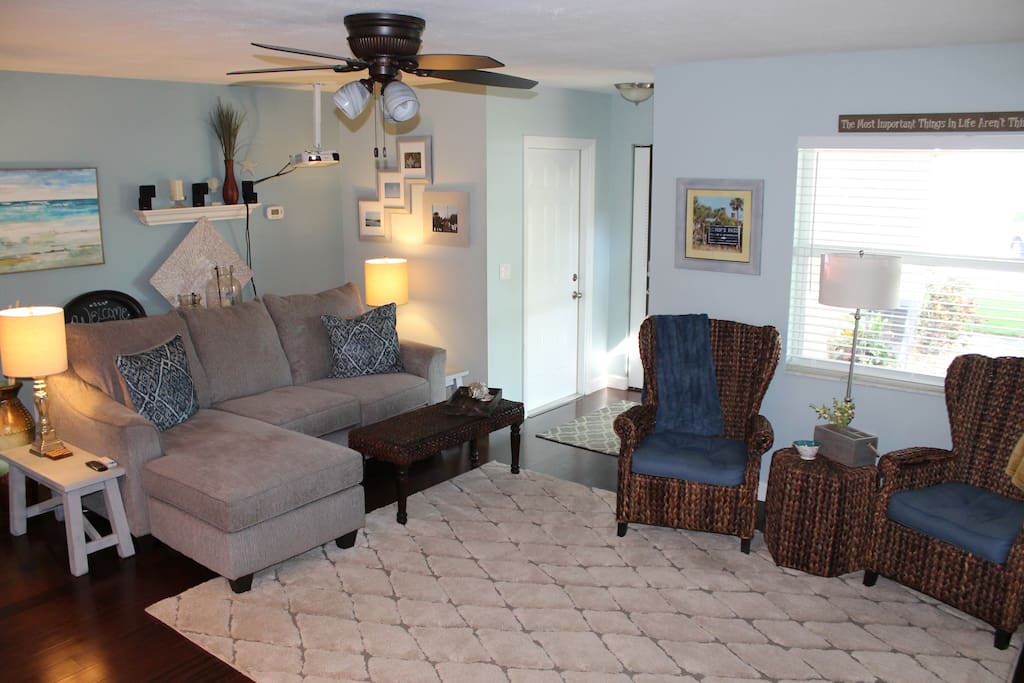 View of living room from the kitchen. Large projection TV and surround sound. Perfect for movies and gaming.