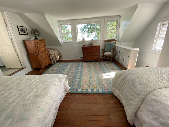 Main House - Upstairs Bedroom with lovely water view. One queen and one single bed. 