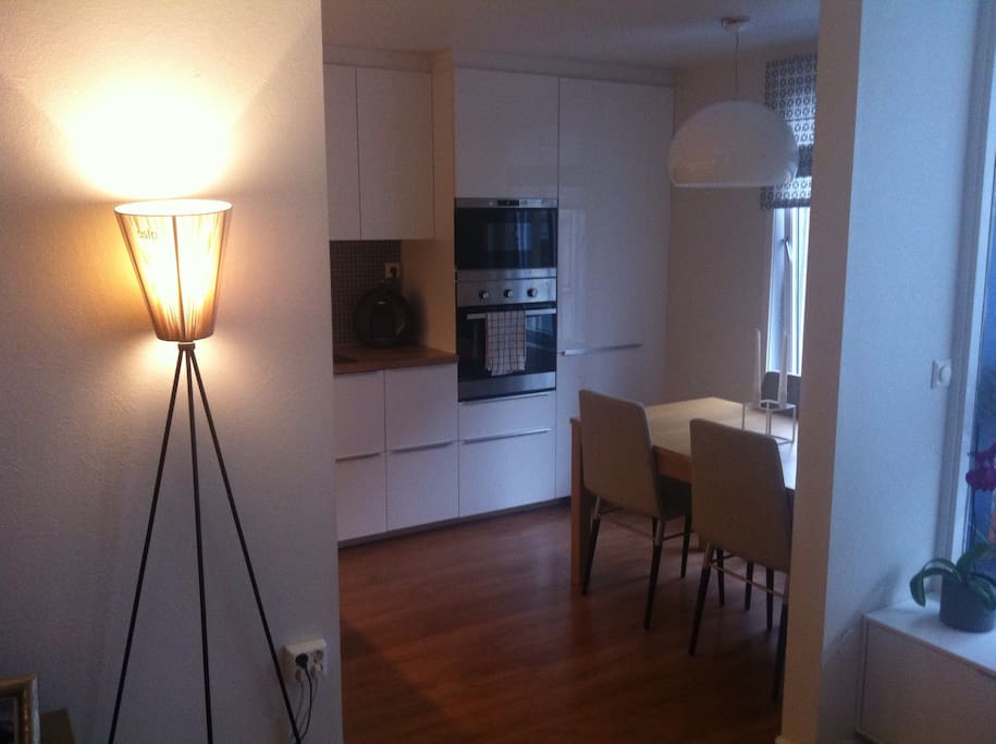 Brand new kitchen with table for wining and dining.