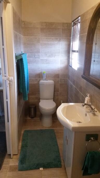 On suite bathroom with shower.